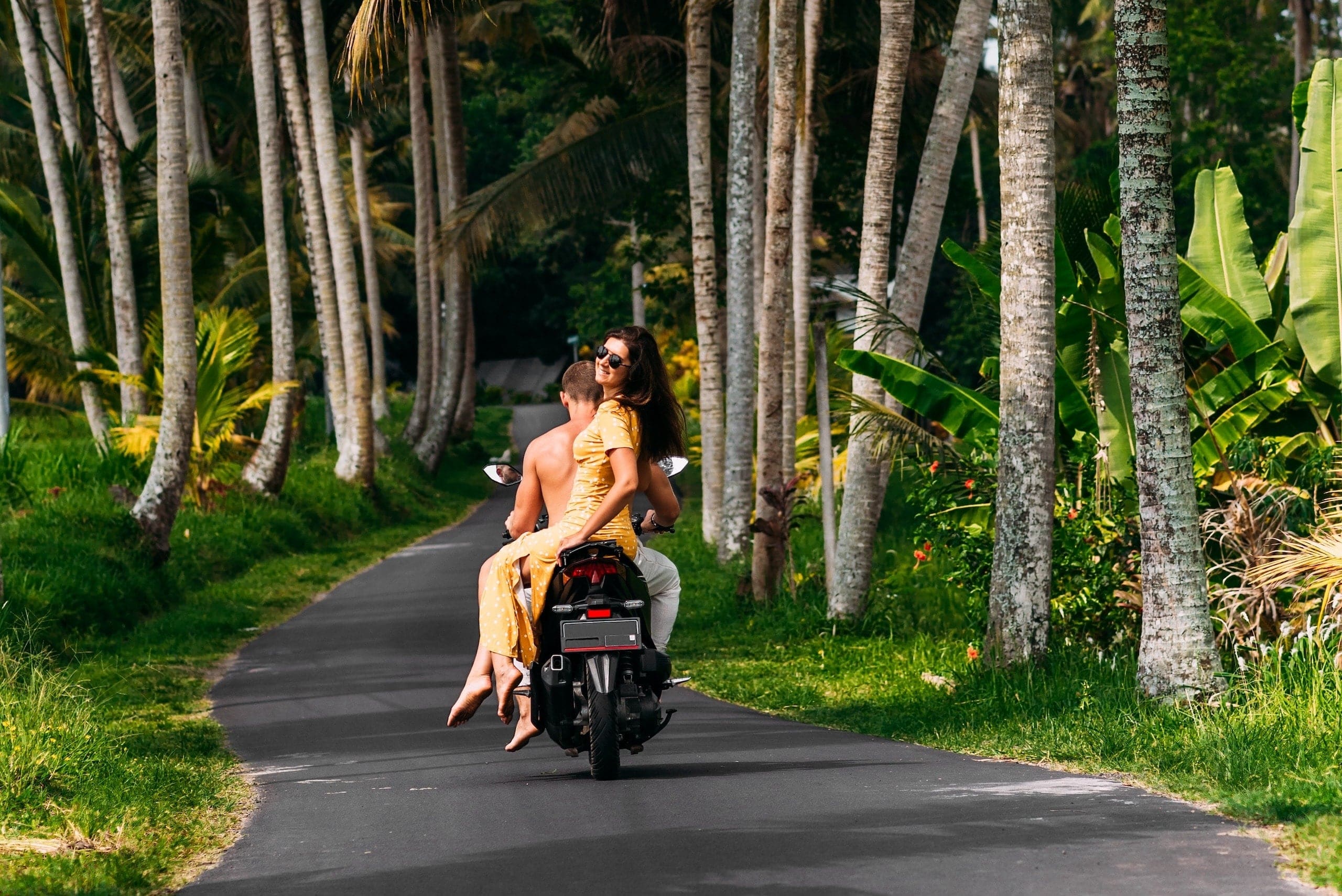 a-couple-in-love-on-a-scooter-among-the-palm-trees-2025-01-08-14-23-17-utc